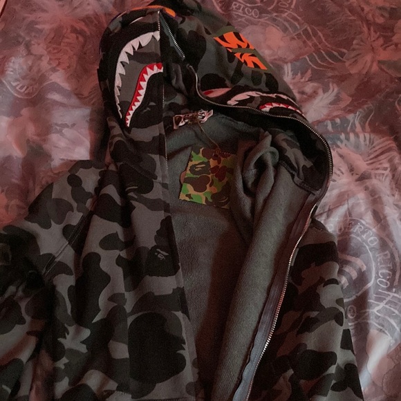 I am selling a bape hoodie this hoodie is black in white it’s in good condition